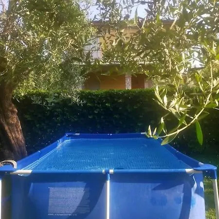 Апартаменты Memy's House Trilocale Con Giardino
